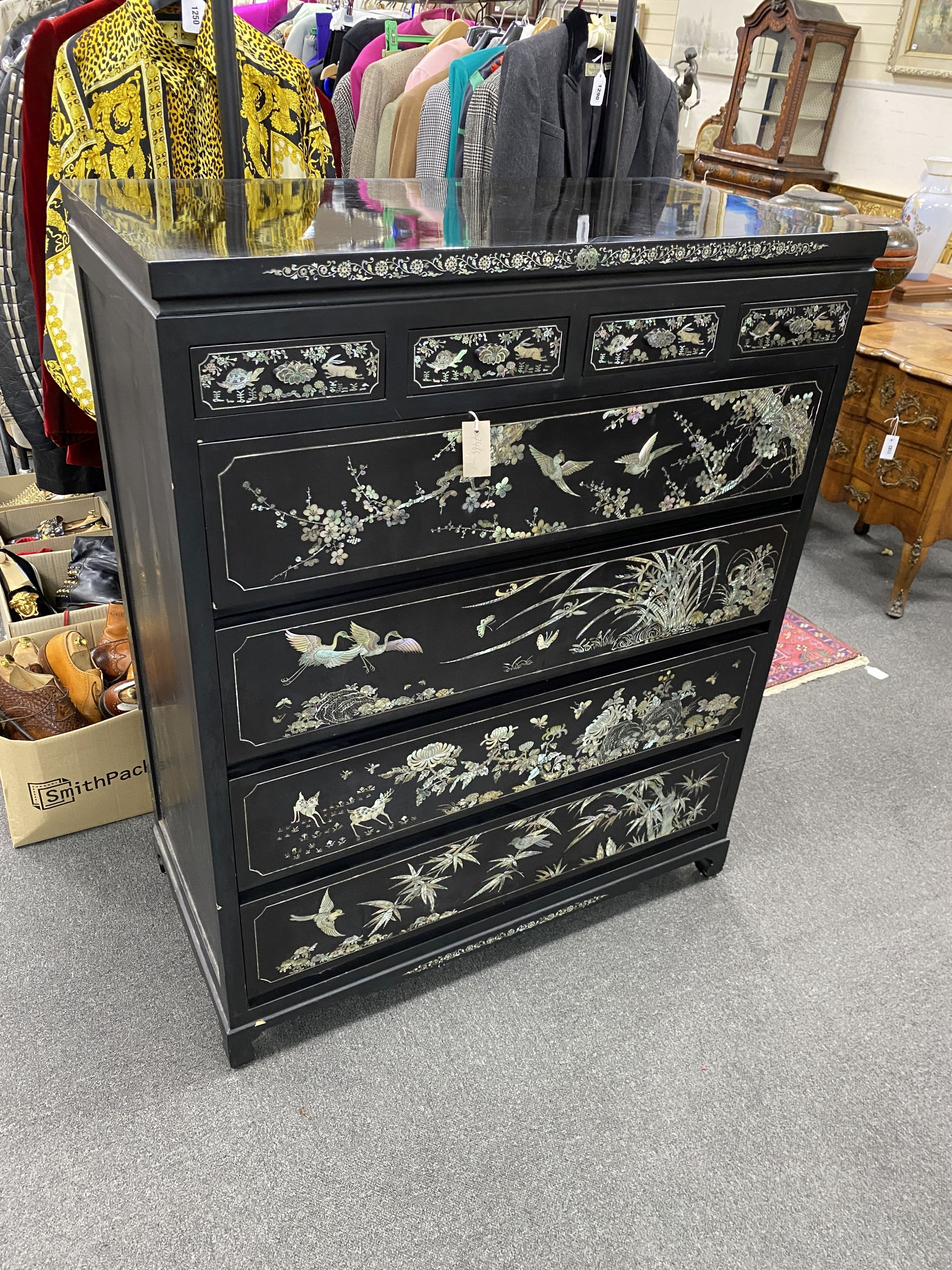 A Japanese black lacquer and mother of pearl inlaid kimono chest, width 104cm, depth 52cm, height 128cm